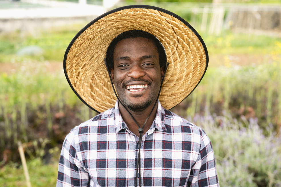 Smiling African Farmer on a Farmland